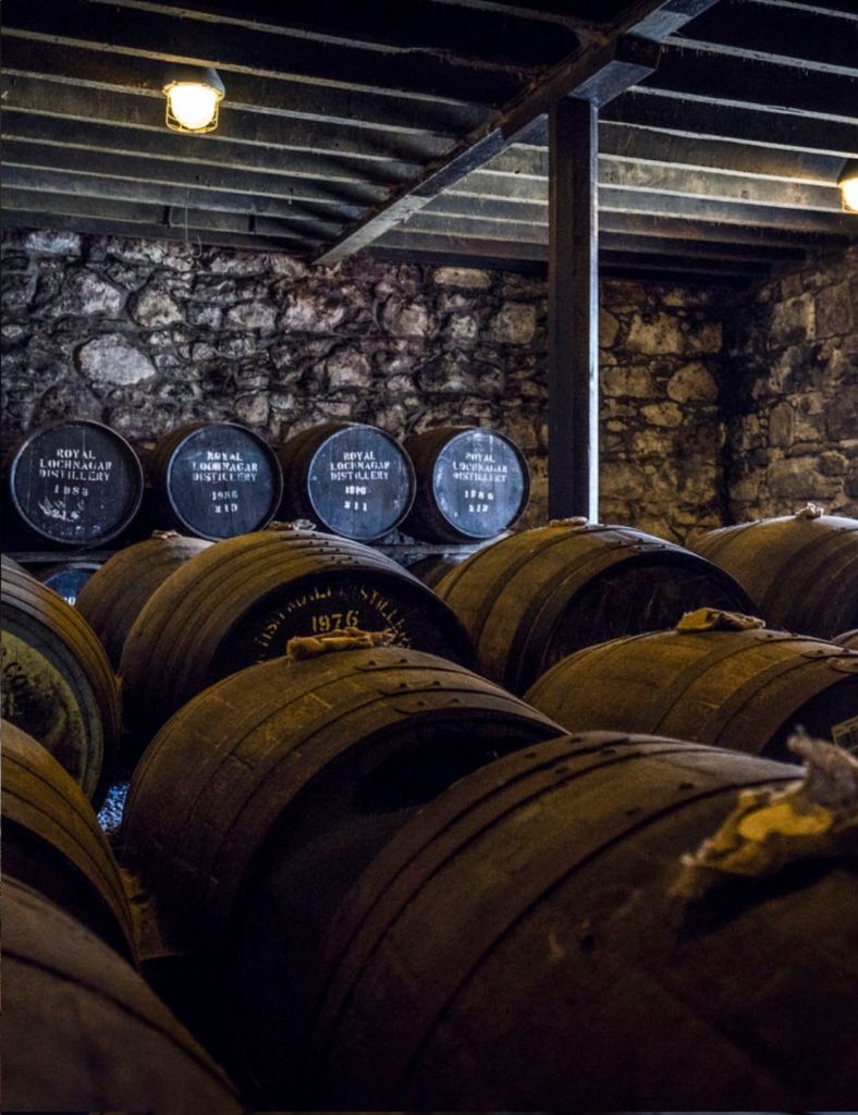 Whisky barrels piled up in the cellar at Royal Lochnagar whisky distillery