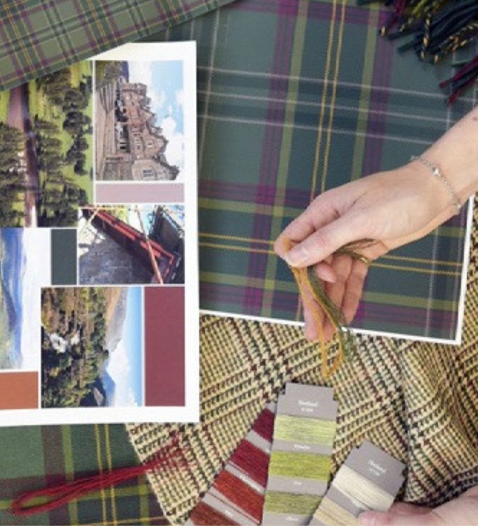 A moodboard of designs, thread colours and inspiration pictures on a table.