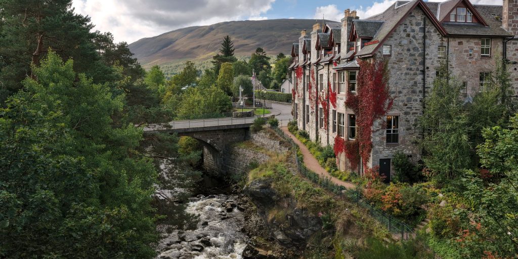 Exterior of the Fife Arms hotel looking down on to the Clunie Water