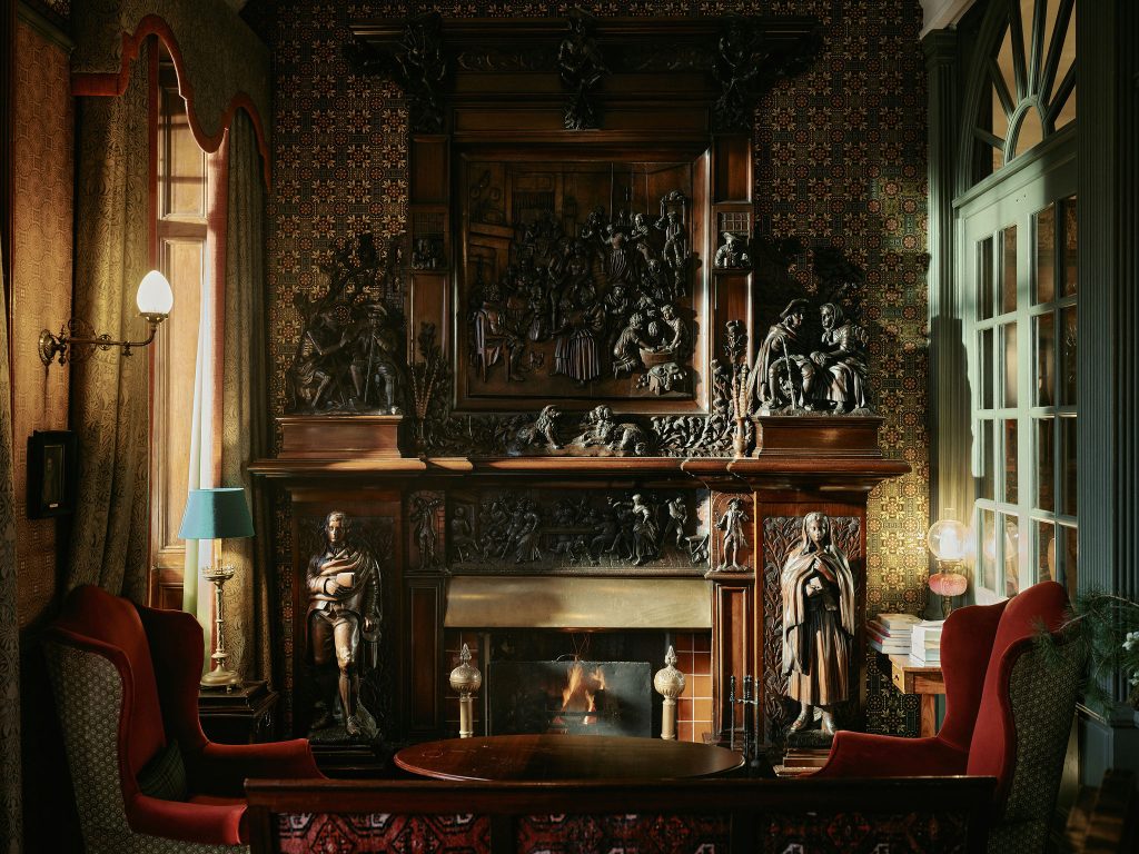 Robert Burns fireplace with fire lit in the hotel lobby