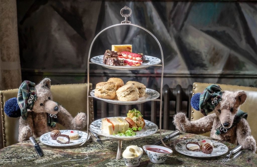 Teddy bear sat at a table for afternoon tea