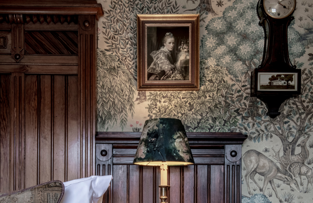 A portrait on patterned wallpaper in the Allan Ramsay room