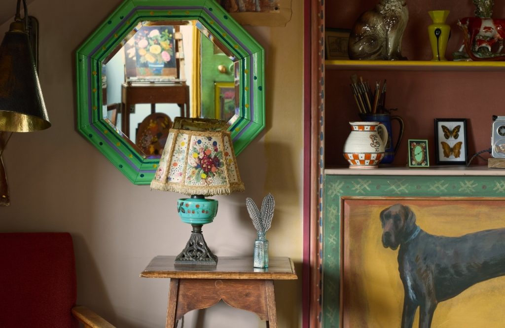 Mirror, lampshade and bookshelves in the Artist's Studio.