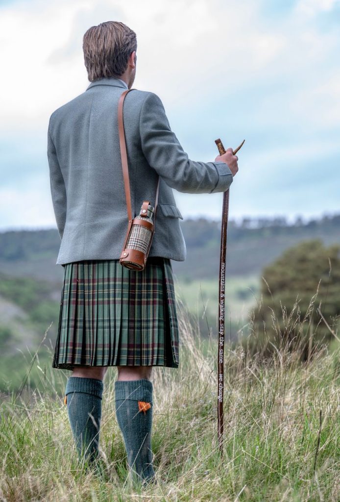 A ghillie in a Highland landscape