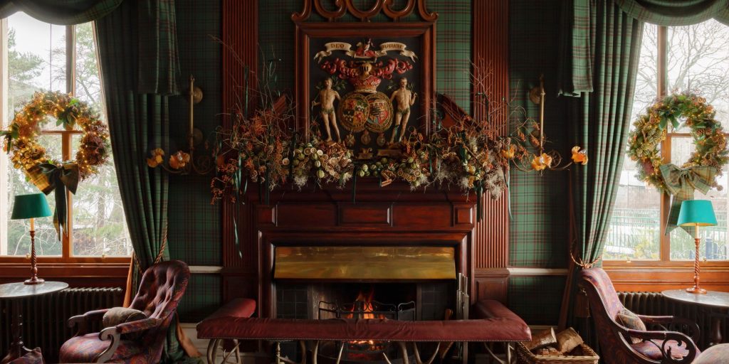 Christmas decorations around a Victorian fireplace
