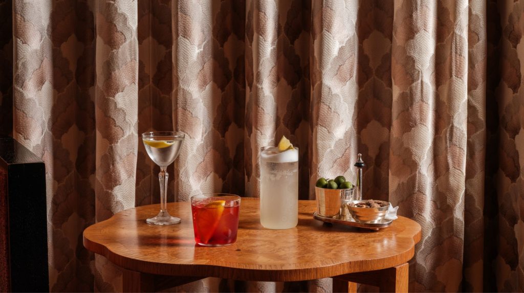 Cocktails and olives on a table in Elsa's Cocktail Bar