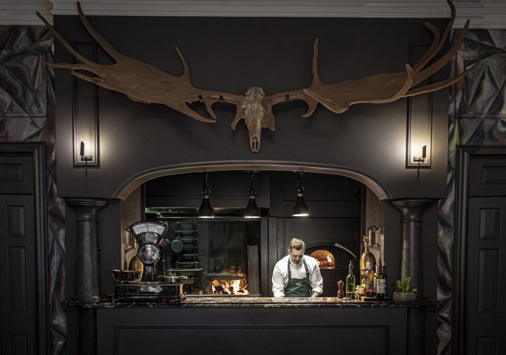 Chefs at the kitchen pass prepping for the day ahead