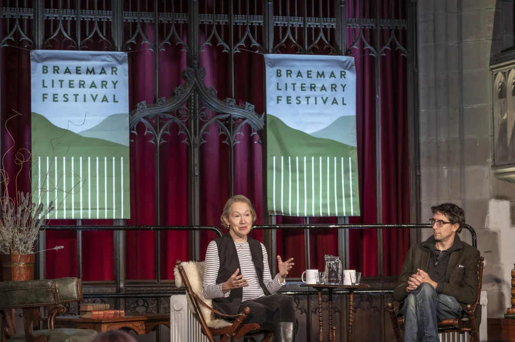 woman talking on stage at the Braemar Literary Festival