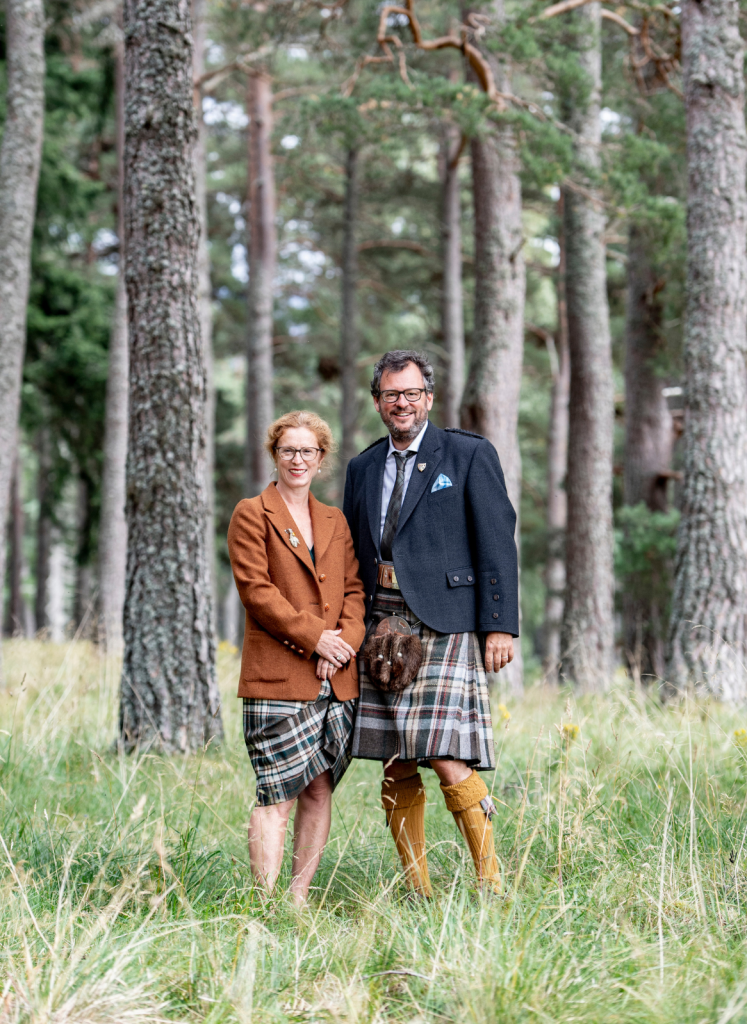 Iwan and Manuela standing together in a woodland