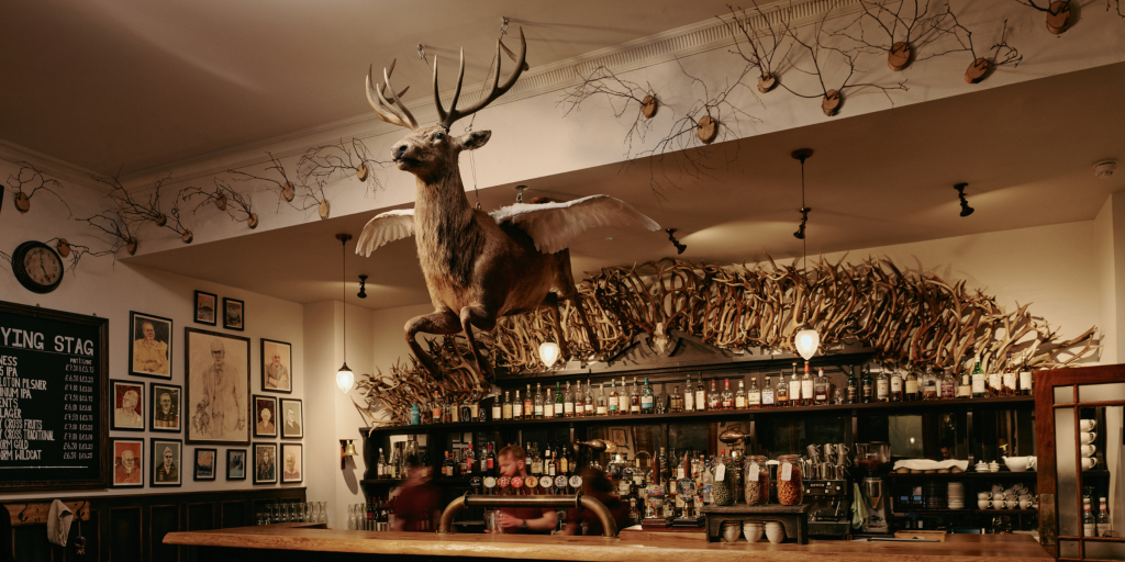 The flying stag above the bar in the pub