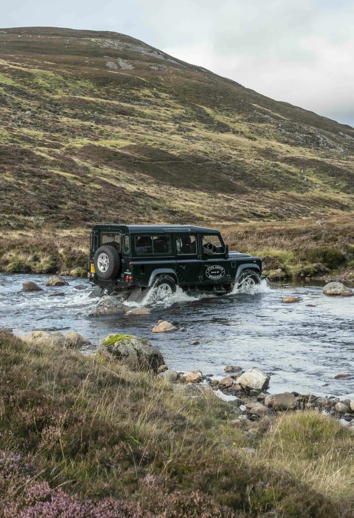 Fife Arms Land Rover driving through a river