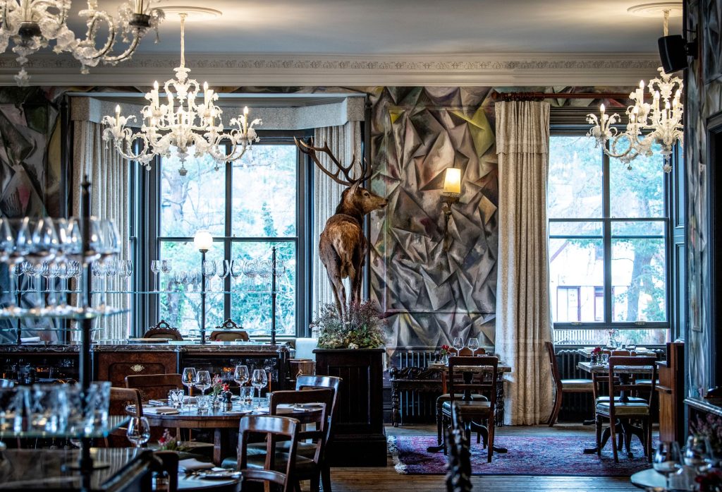 The Clunie Dining Room with a proud taxidermy stag