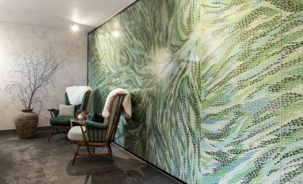 A green and blue mural in the Albamhor treatment rooms, created by artist Bharti Kher