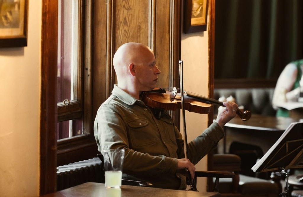A violinist performing in the Flying Stag