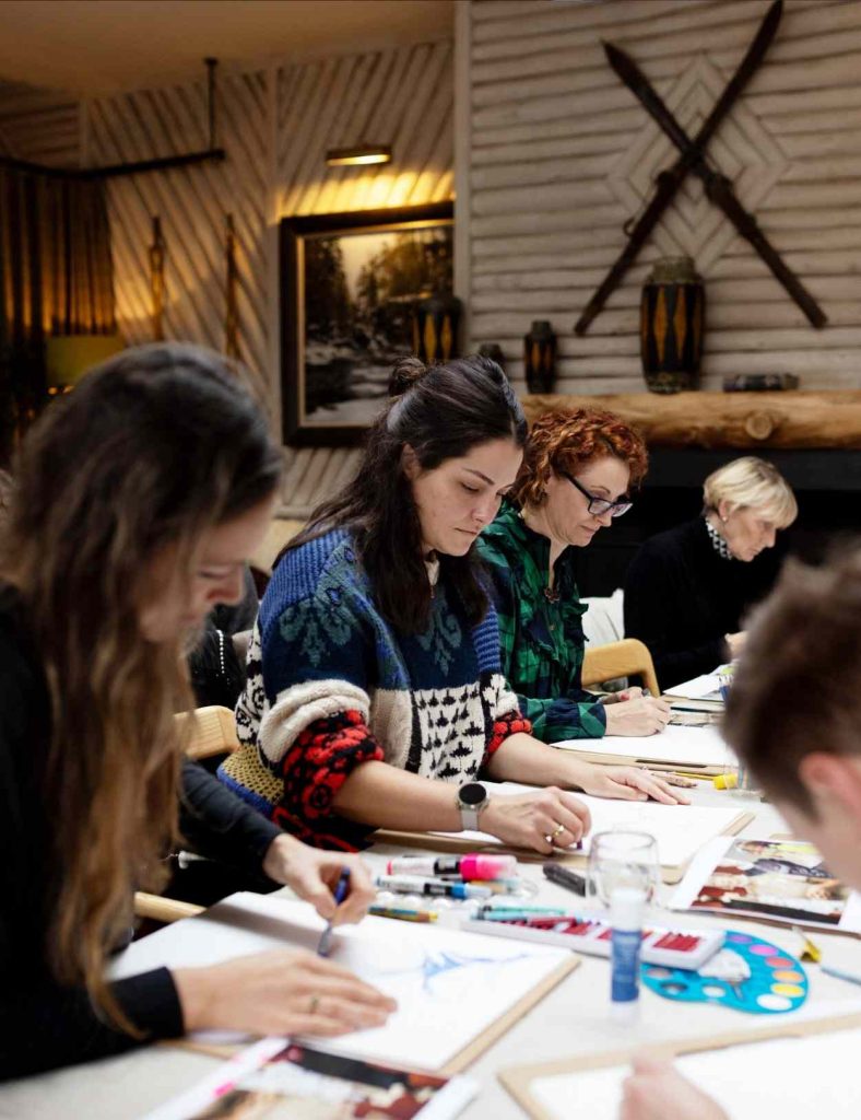 Festival attendees enjoying the illustration workshop held by Jessica Rose Bird in 2025