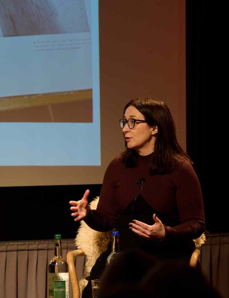 Caroline Young on-stage at Festival of Fashion talking about Frances Farquharson