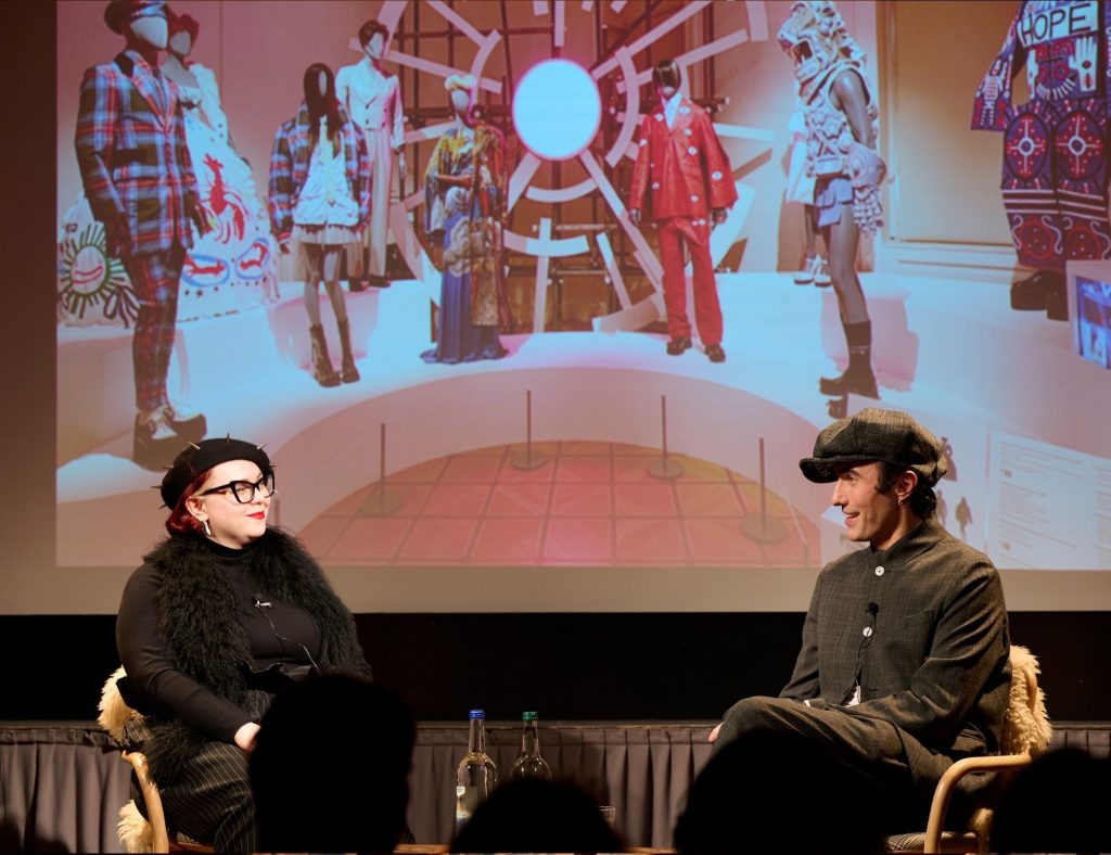 Charles Jeffrey on-stage with Fenella Hitchcock at Festival of Fashion