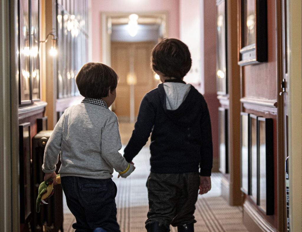 Two boys exploring the hotel on the treasure hunt