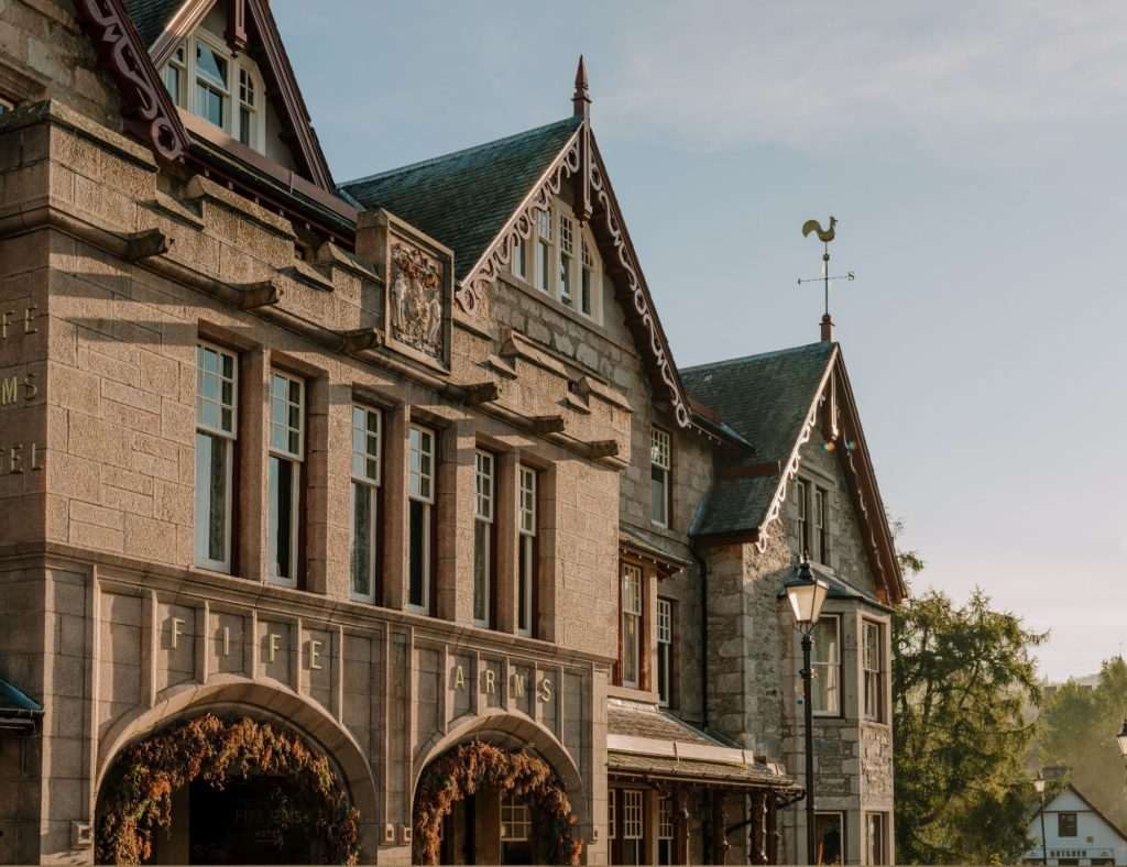 The exterior of the Fife Arms hotel with blue sky in the background