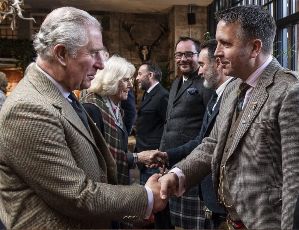 Their Royal Highnesses shaking hands with the team who helped with the renovation of the hotel.
