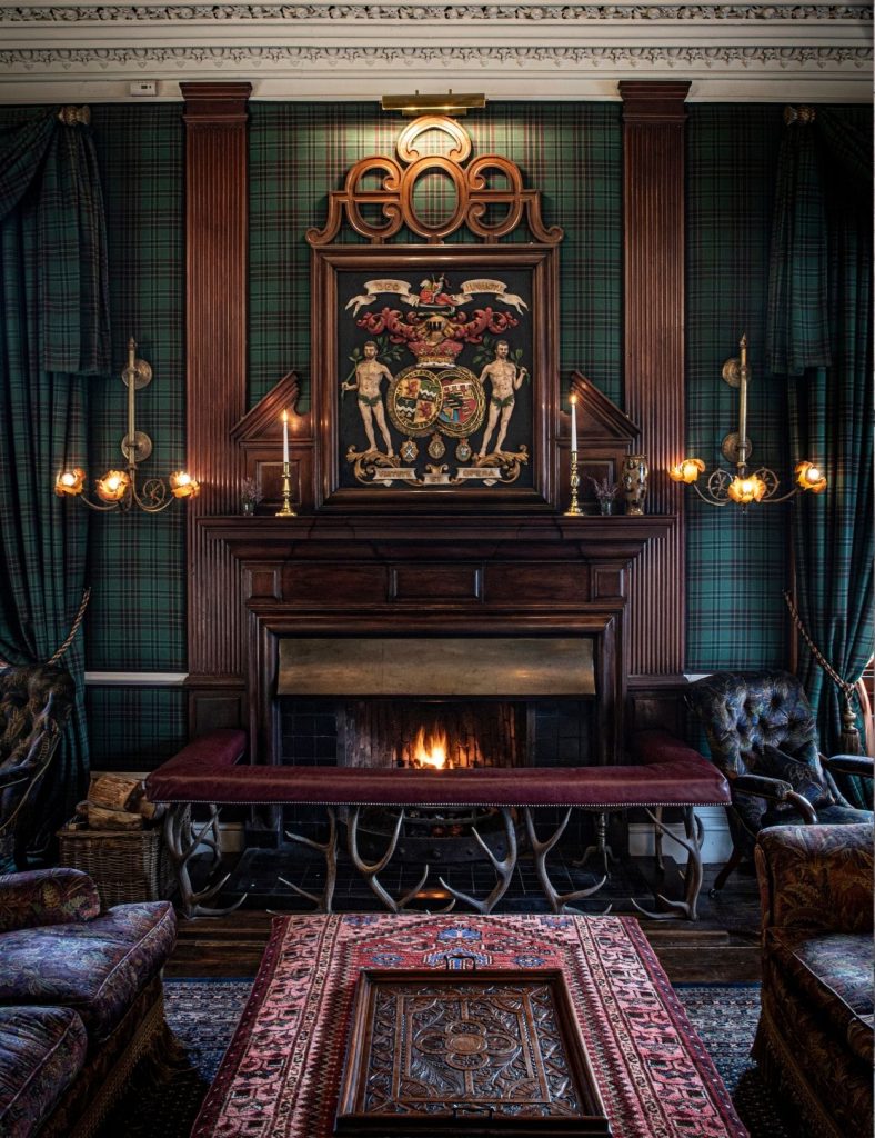 Fireplace in the drawing room with a roaring fire