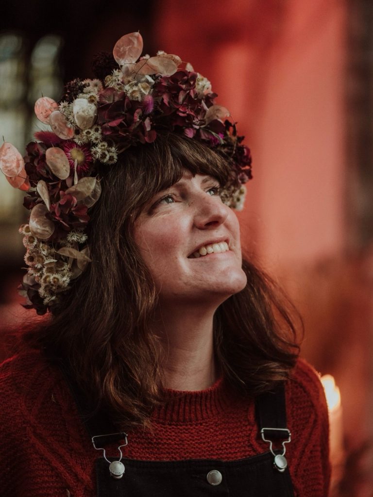 A woman wearing a flower crown