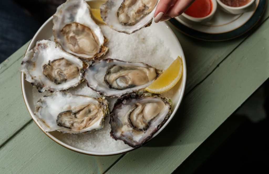 Oysters on a dish with a slice of lemon