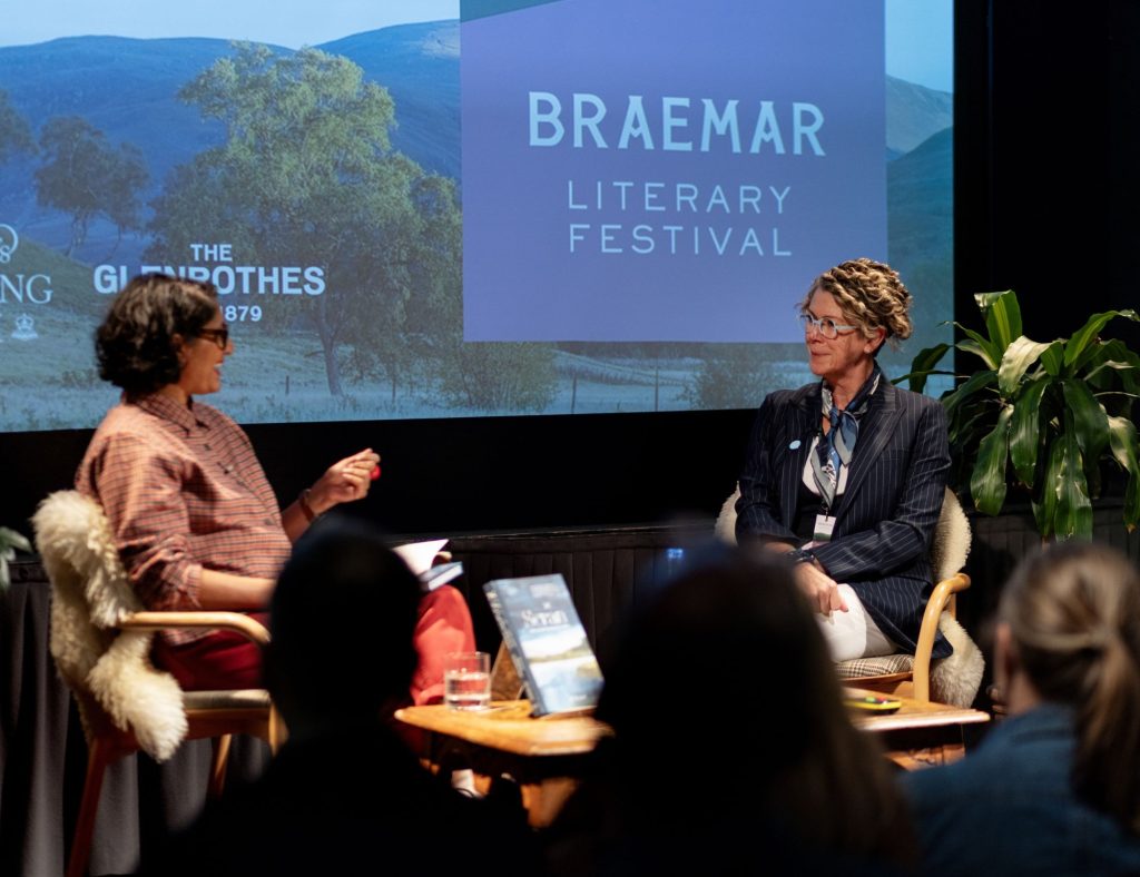 Two women speaking on stage at Braemar Literary Festival