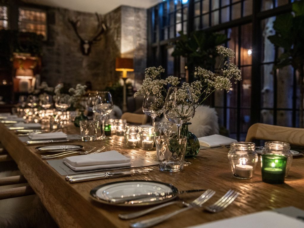 A celebratory dining banquet table in a dimly lit room