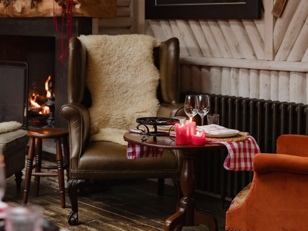 A leather armchair covered with a sheepskin