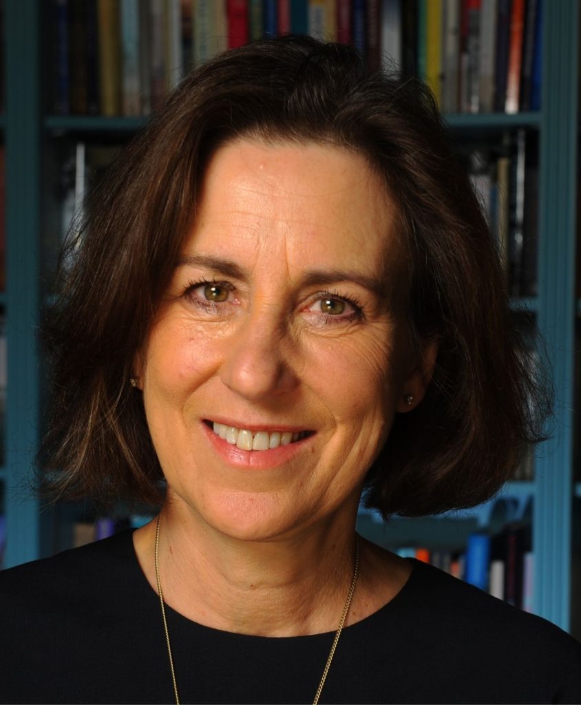A smiling woman with short dark hair